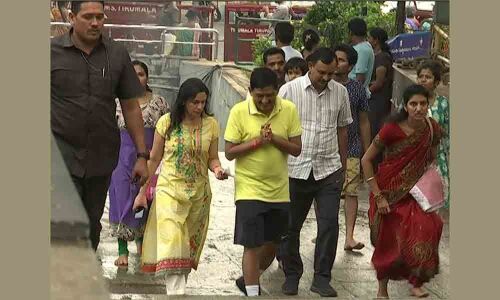 Police chief, family walk to Tirumala hills