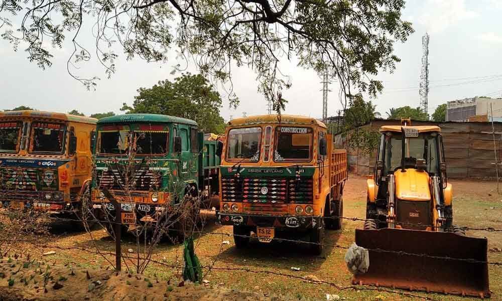 Red soil transport vehicles seized