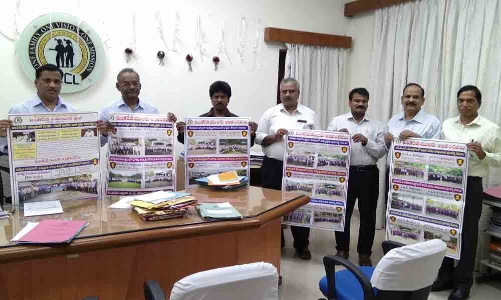 SCCL releases wall posters reminding milestones it crossed in Kothagudem