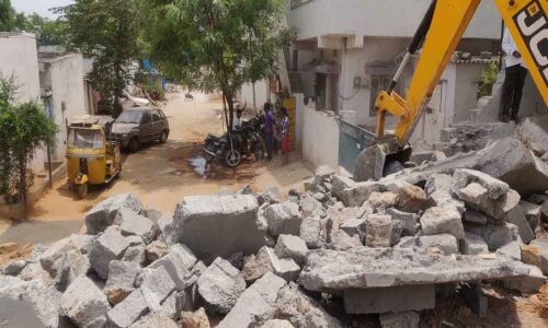 GHMC razes illegal compound wall