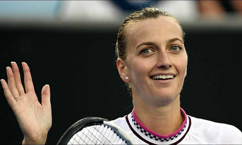 Reigning champion Petra Kvitova brushes past Mladenovic in Madrid
