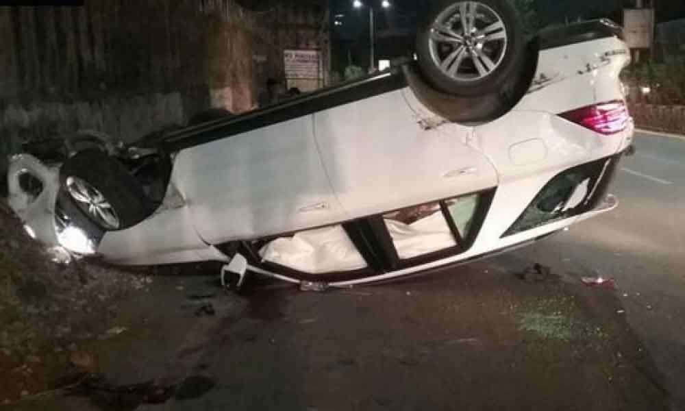 Two injured when a car turned turtle at Khairatabad fly over