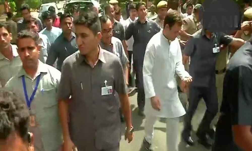 Rahul Gandhi walks to cast his vote