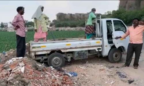 Piles of debris filling Shah Hatim Talab