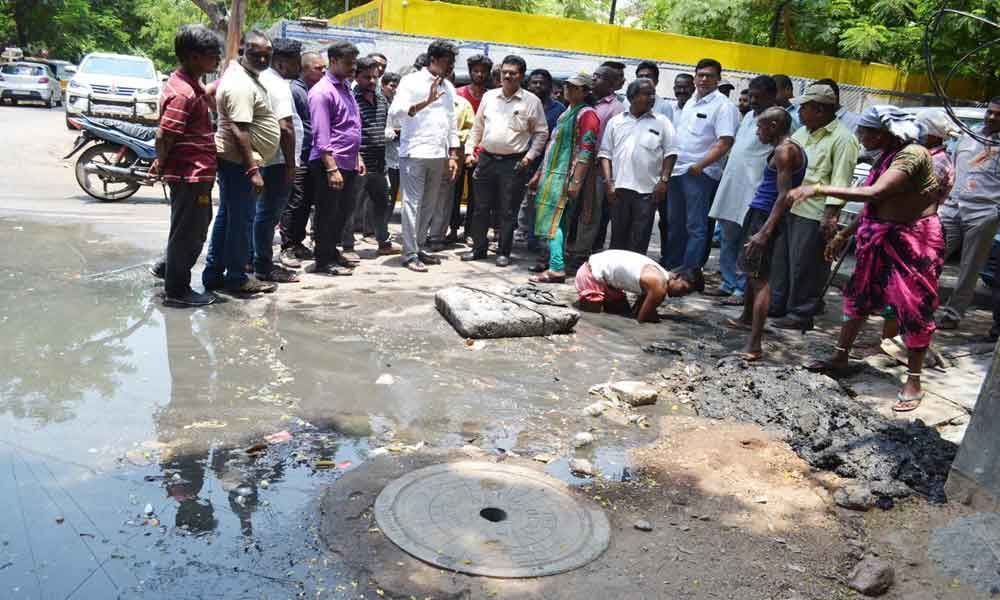 Corporator inspects sewage overflow