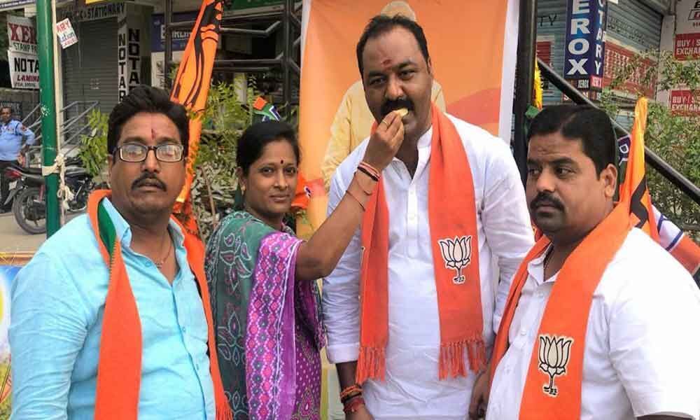 BJP cadre holds poll victory celebrations