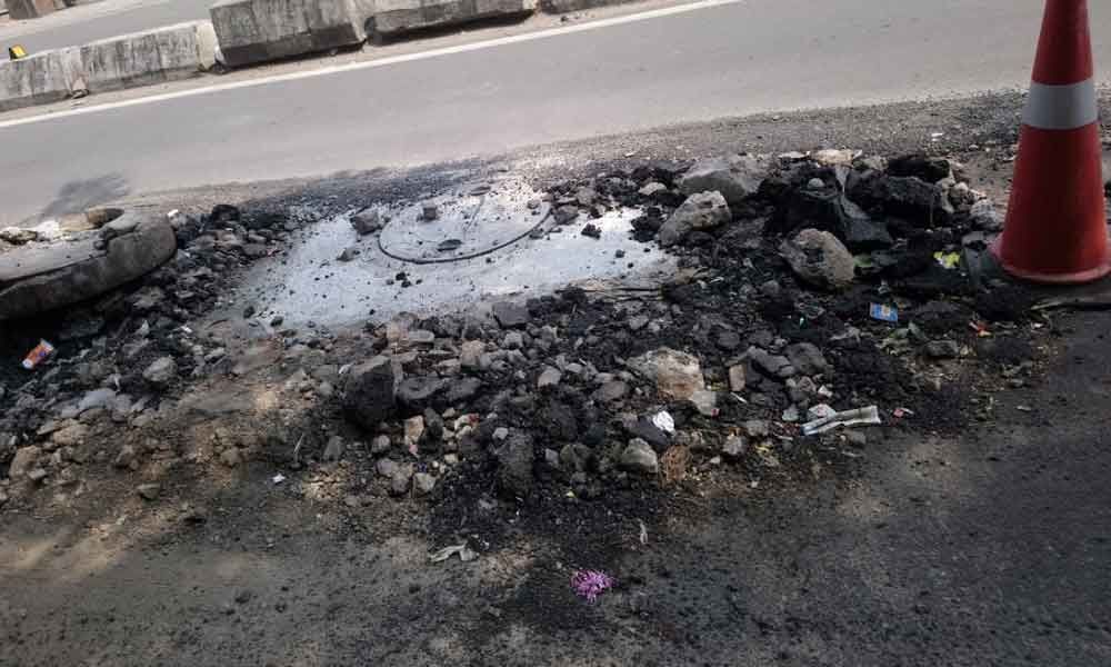 Manhole covers installed, but debris left behind