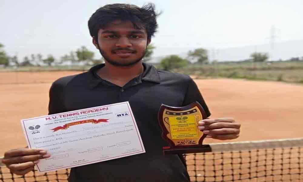 Preetham wins trophy in Tennis under 18 category
