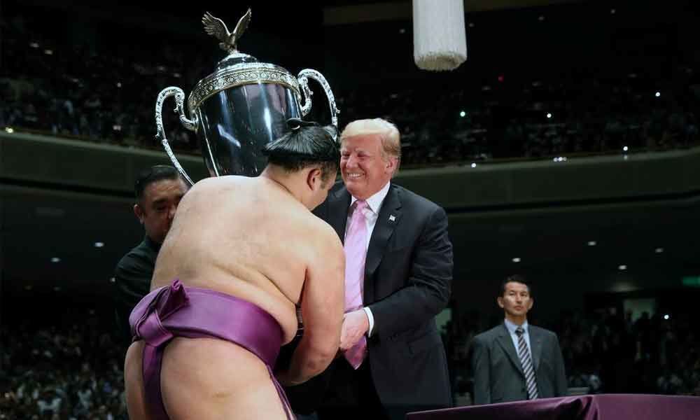 Trump watches incredible sumo wrestling in Japan