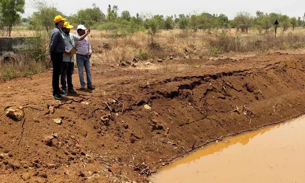 ICRISAT officials inspect watershed works