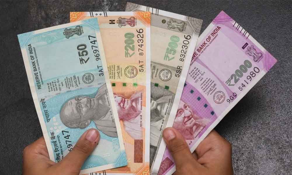 Rupee slips 15 paise to 69.84 vs USD in early trade