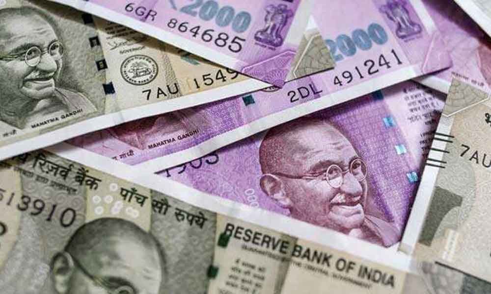Rupee rises 12 paise to 69.71 vs USD in early trade