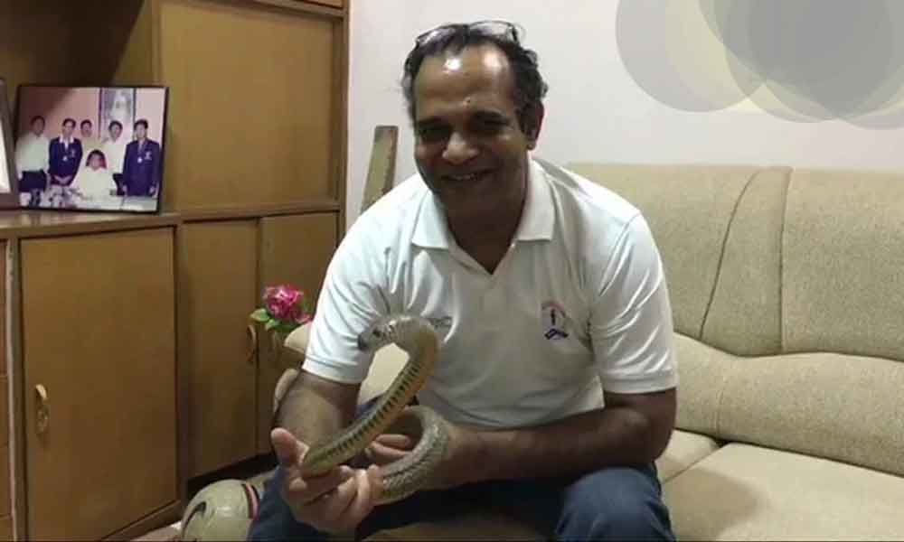 Income-Tax officer rescues snake attacked with pesticide in Indore