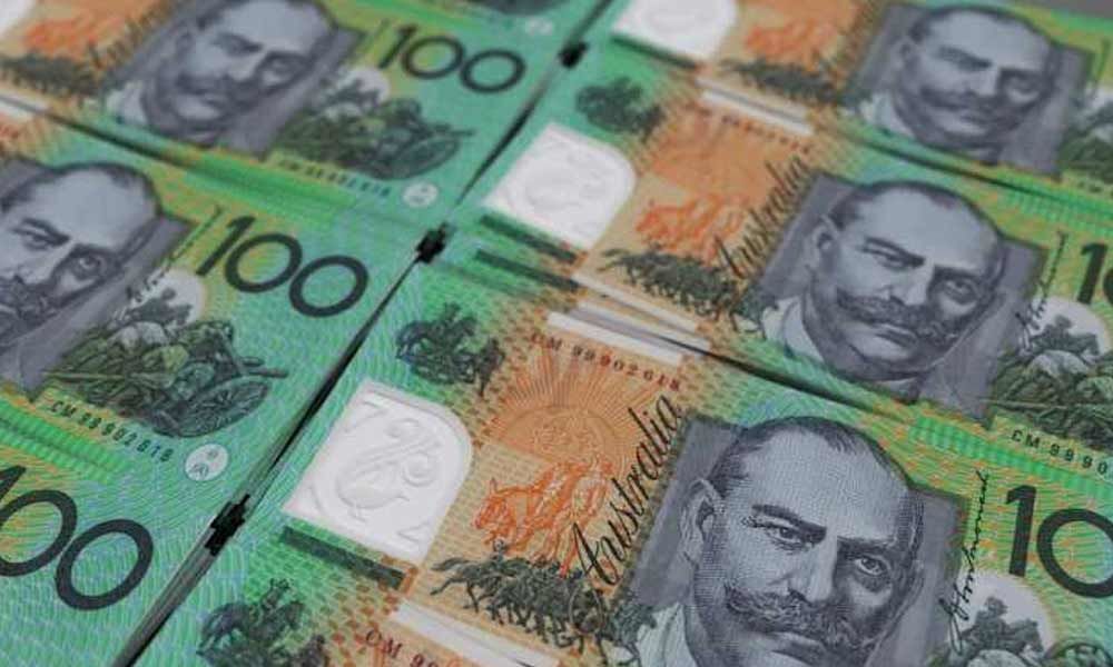 Australia cuts rates to historic low as economy slows