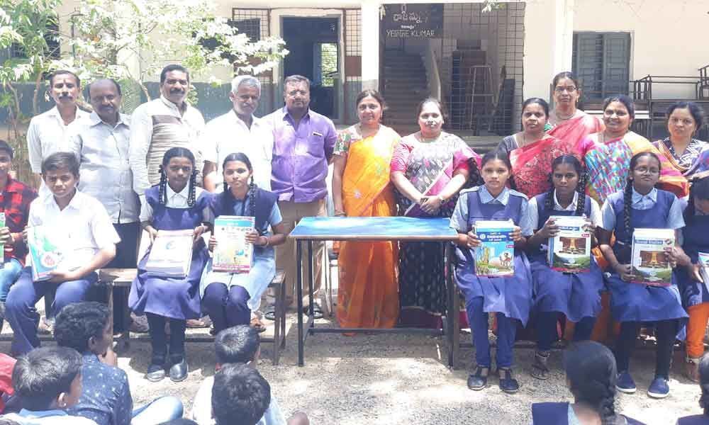 Corporator Cheruku Sangeetha distributes books to poor students