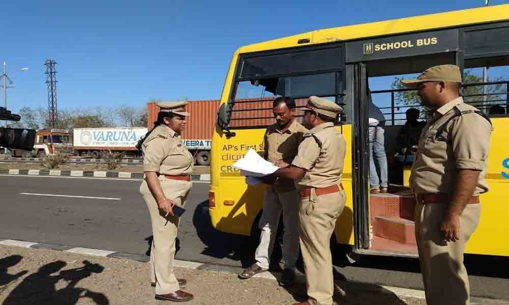 Motor Vehicle Inspectors inspect school buses in Adilabad