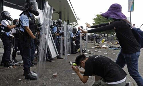 Hong Kong police use tear gas as protesters try to storm parliament