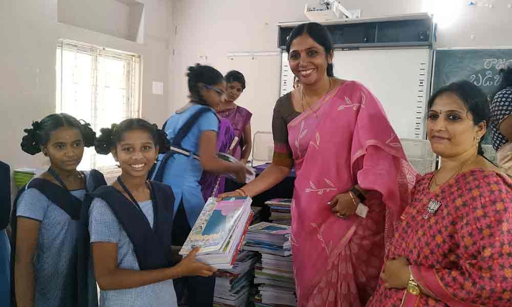 Mayor distributes textbooks, shoes to students