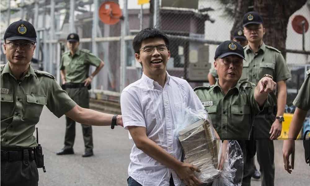 Hong Kong activist Joshua Wong walks free, calls on leader to resign