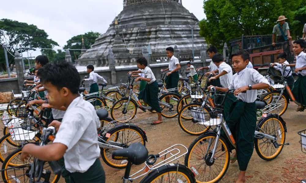 Ride on time: Recycled bikes get Myanmar kids to school