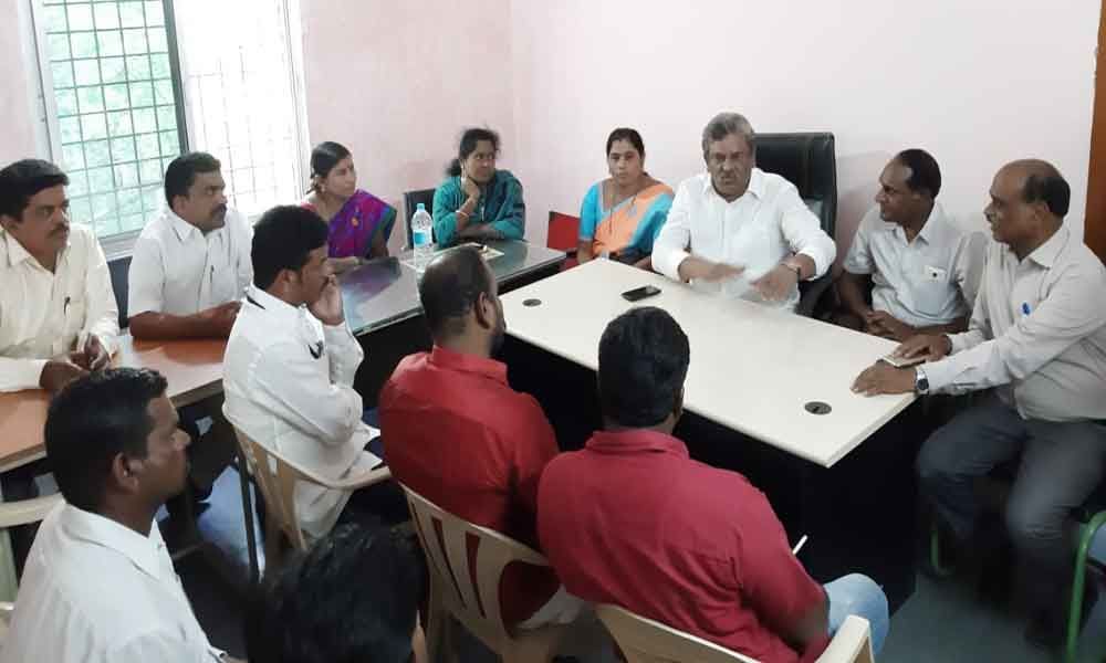 Corporator Mandadi Srinivas Rao meets with sanitation officials