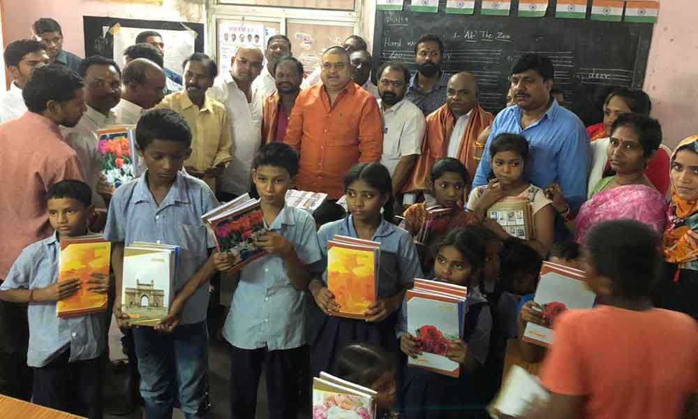 BJP leaders gesture to govt school kids