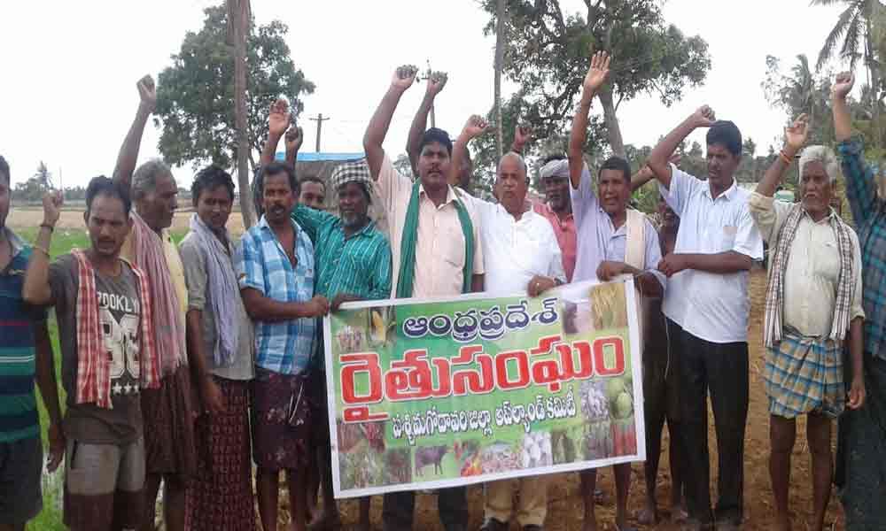 Farmers block road over crop arrears AP Rythu Sangham