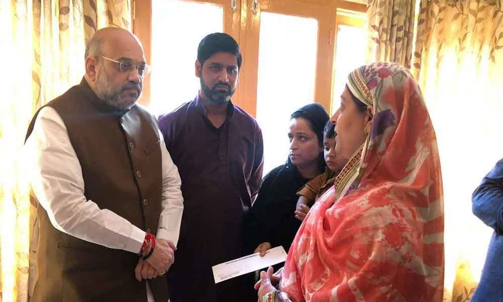 Amit Shah visits family of slain policeman in Srinagar