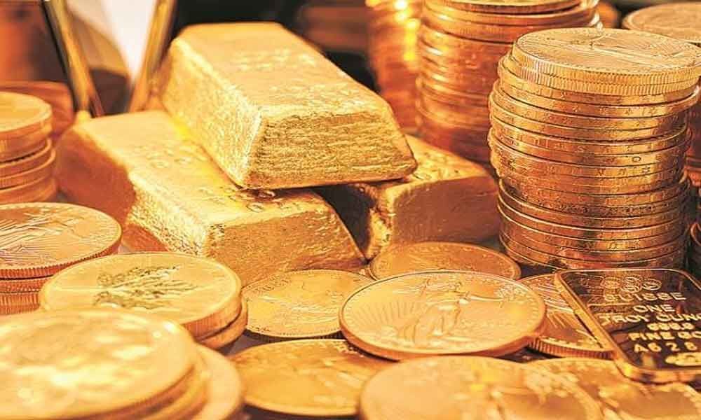 Gold slides by Rs 130 on muted demand, weak global cues