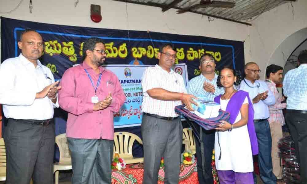 Visakhapatnam Port Trust distributes schoolbags to students in Visakhapatnam
