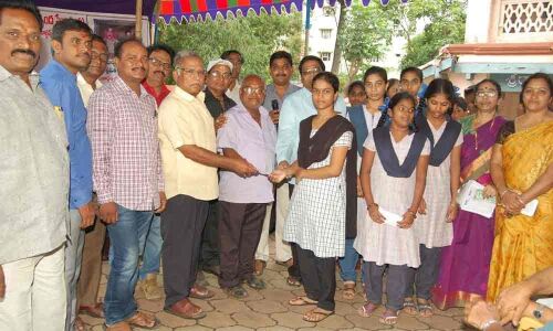 Old age pensions, scholarships distributed Walkers Yoga Club