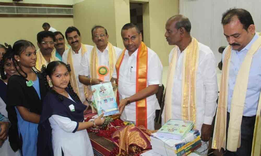 Minister Velampalli Srinivas distributes free books
