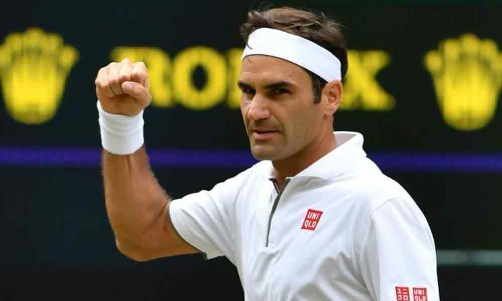 Federer posts new Slam record as favourites cruise into last 16