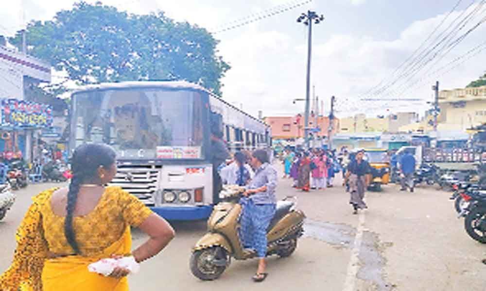 Bus stop sans shelter at Tukaram Gate