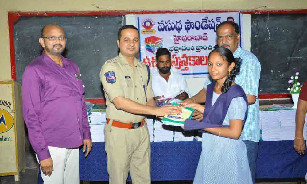 Books, pens distributed to students in Bhadrachalam