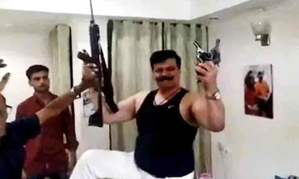 BJPs Champion MLA dances with guns in hands