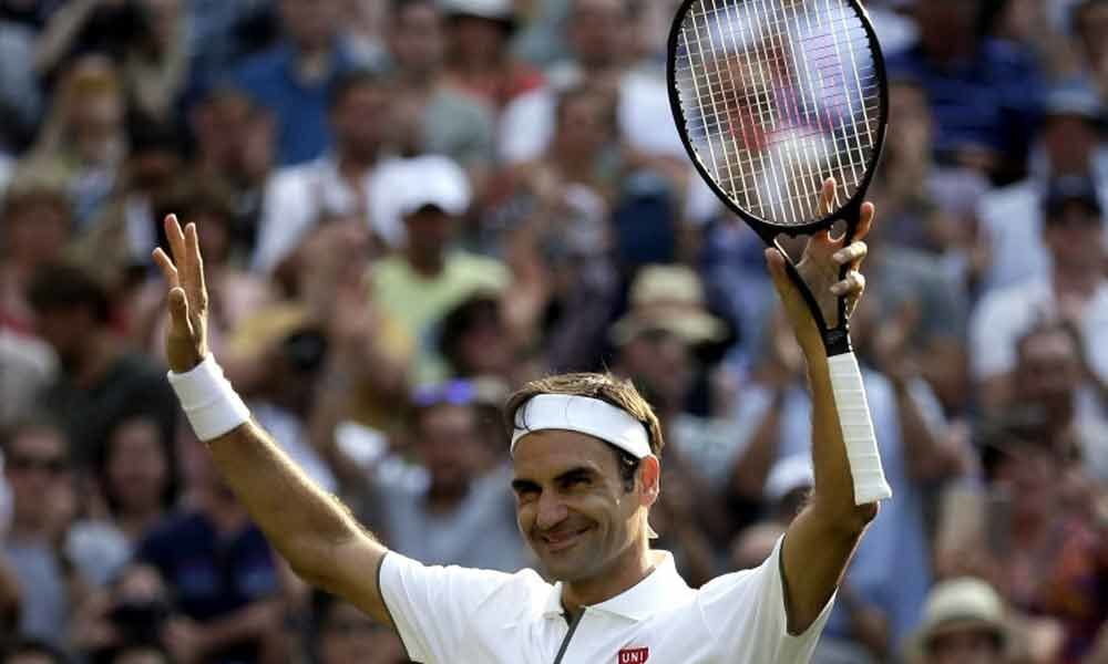 Federer wins 100th Wimbledon match to reach 13th semi-final
