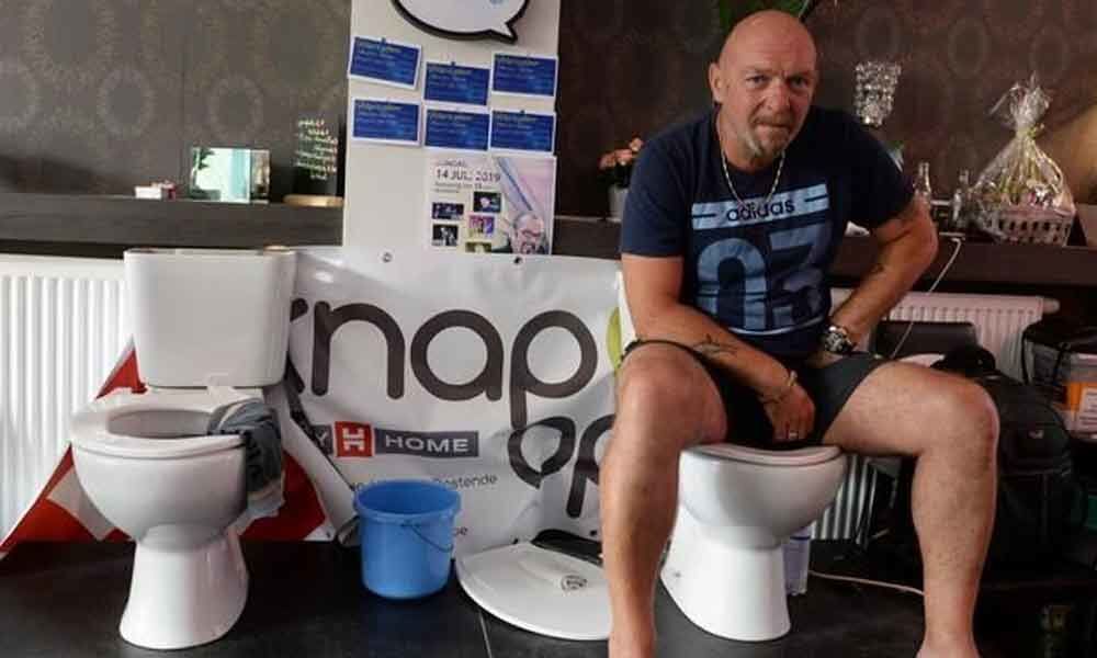 Belgian man sits on the toilet for five days in a bid for a record
