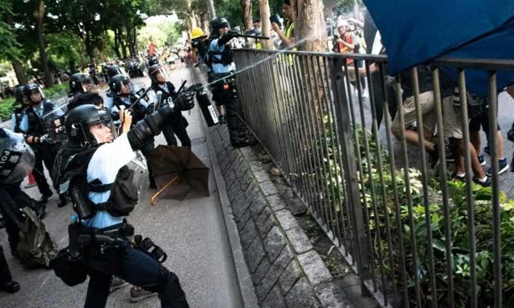 Clashes as Hong Kong protesters vent at China border traders