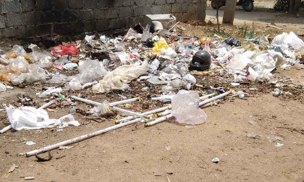 GHMC workers fail to clear garbage
