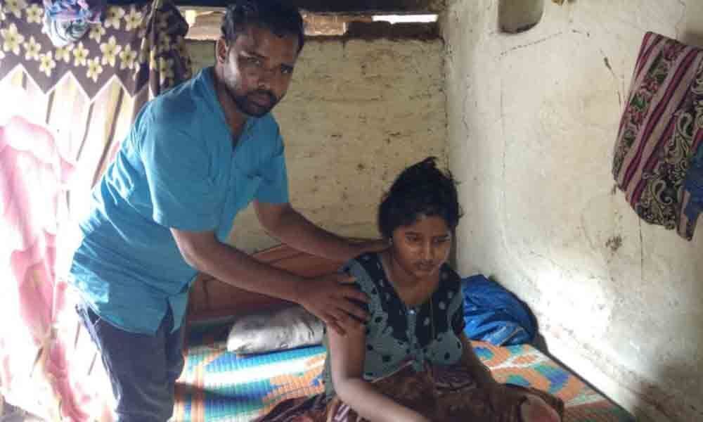 Man seeks financial help for wifes treatment in Kamareddy