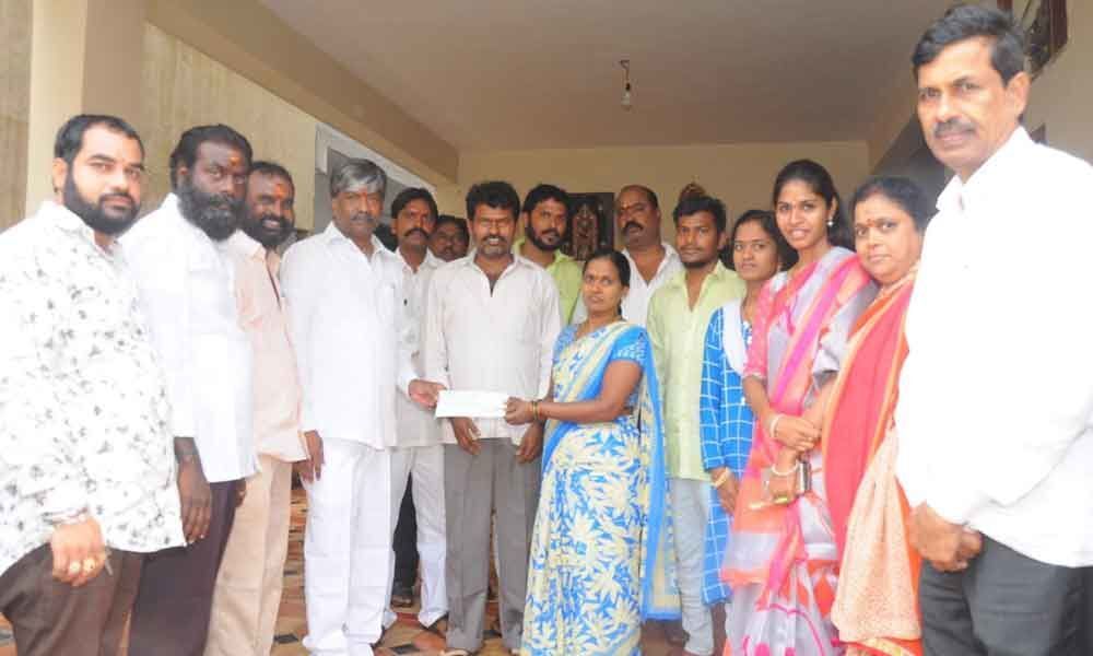 T Padma Rao Goud hands over cheques to beneficiaries
