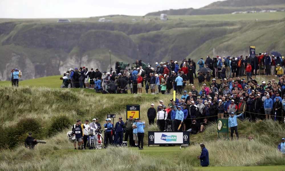 The Latest: Duval posts a 13 on par-5 7th at British Open