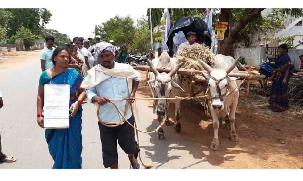 Farmer embarks on bullock cart yatra to seek compensation for his lost land in Yellandu