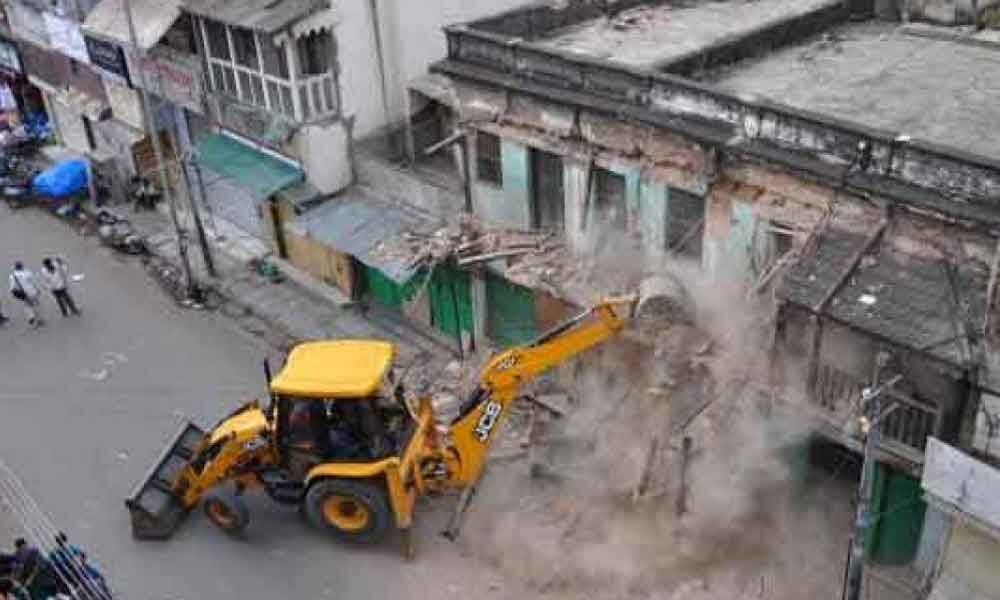 Demolition men razing decrepit structres