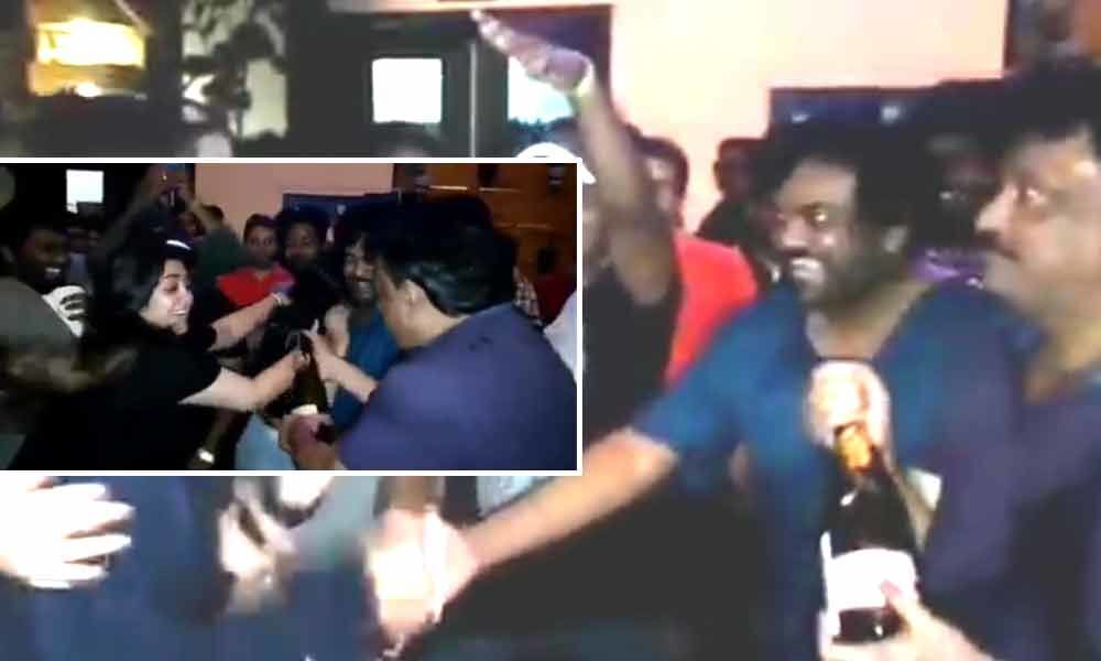 Ram Gopal Varma pours champagne on himself to celebrate iSmart Shankar success