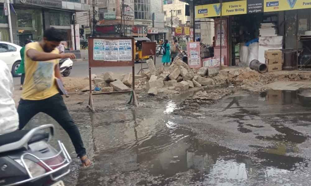 Drain overflows on main road