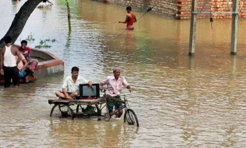 Floods continue to wreak havoc in Bihar, Assam; death toll mounts to 166