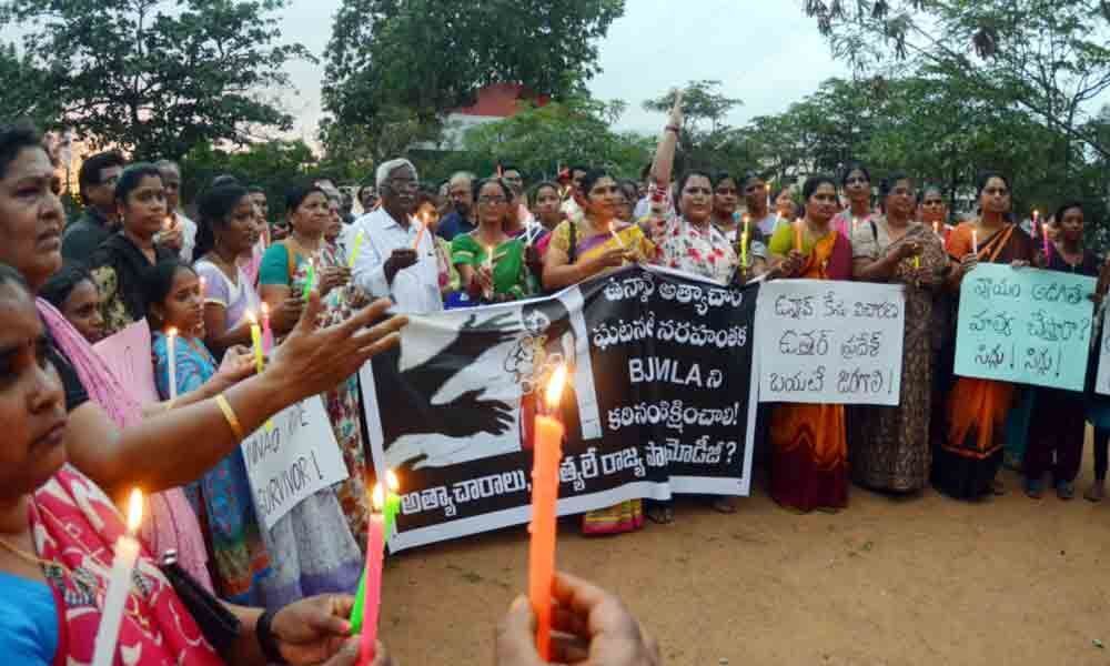 Women stage protest seeking justice for Unnao rape victim in Visakhapatnam