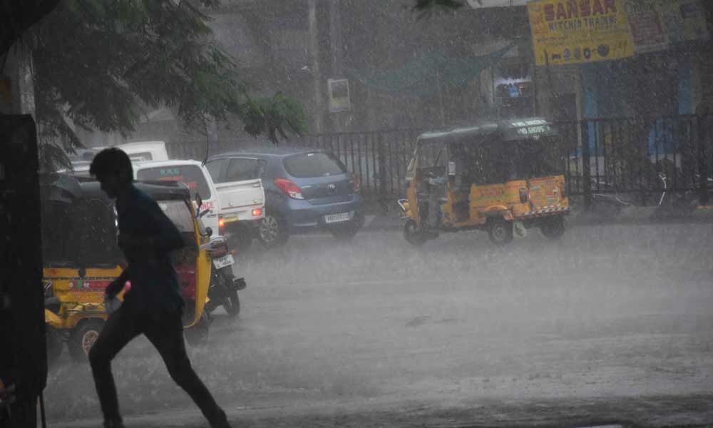 A view of rains from Afzalgunj Bus Stop on Thursday